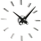 Nomon Puntos Suspensivos 12 Wall Clock | Steel/Chromed Brass