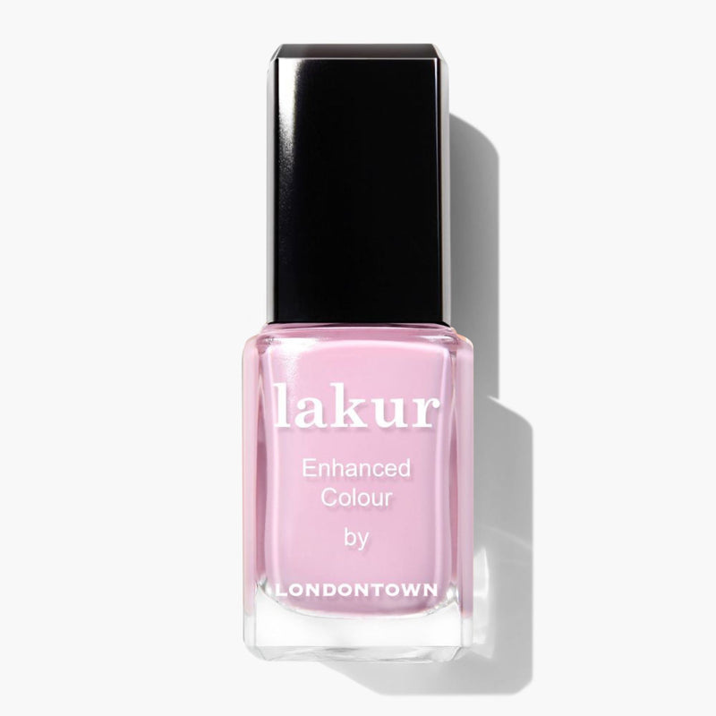 A bottle of LONDONTOWN Pink Palm nail polish in pastel pink with a black cap. The label reads "lakur Enhanced Colour by LONDONTOWN".
