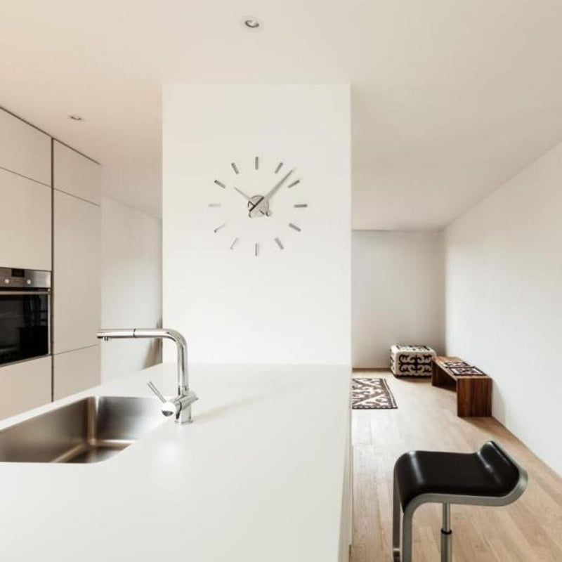 Nomon Puntos Suspensivos 12 Wall Clock | Steel/Chromed Brass